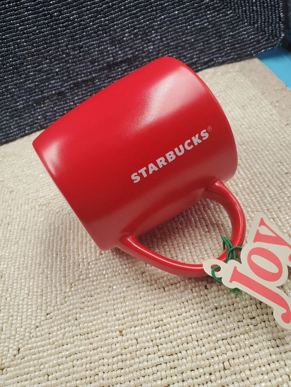 Starbucks mate finished coffee mug featuring a minimalist solid red exterior